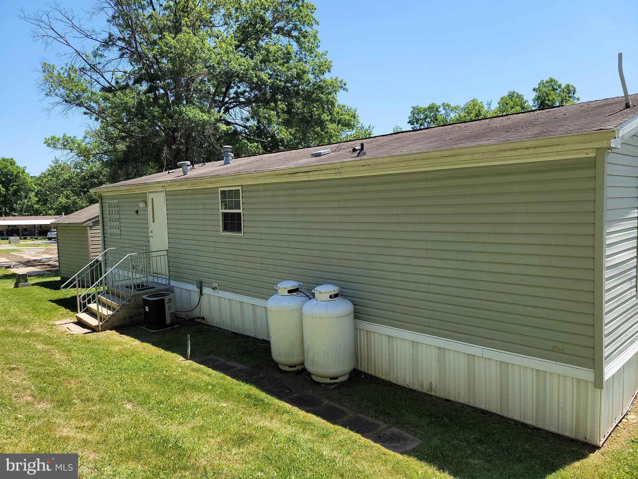 193 Shawnee Avenue Dover, PA 17315 - Photo 2 of 20 a view of a backyard with chairs and a small yard