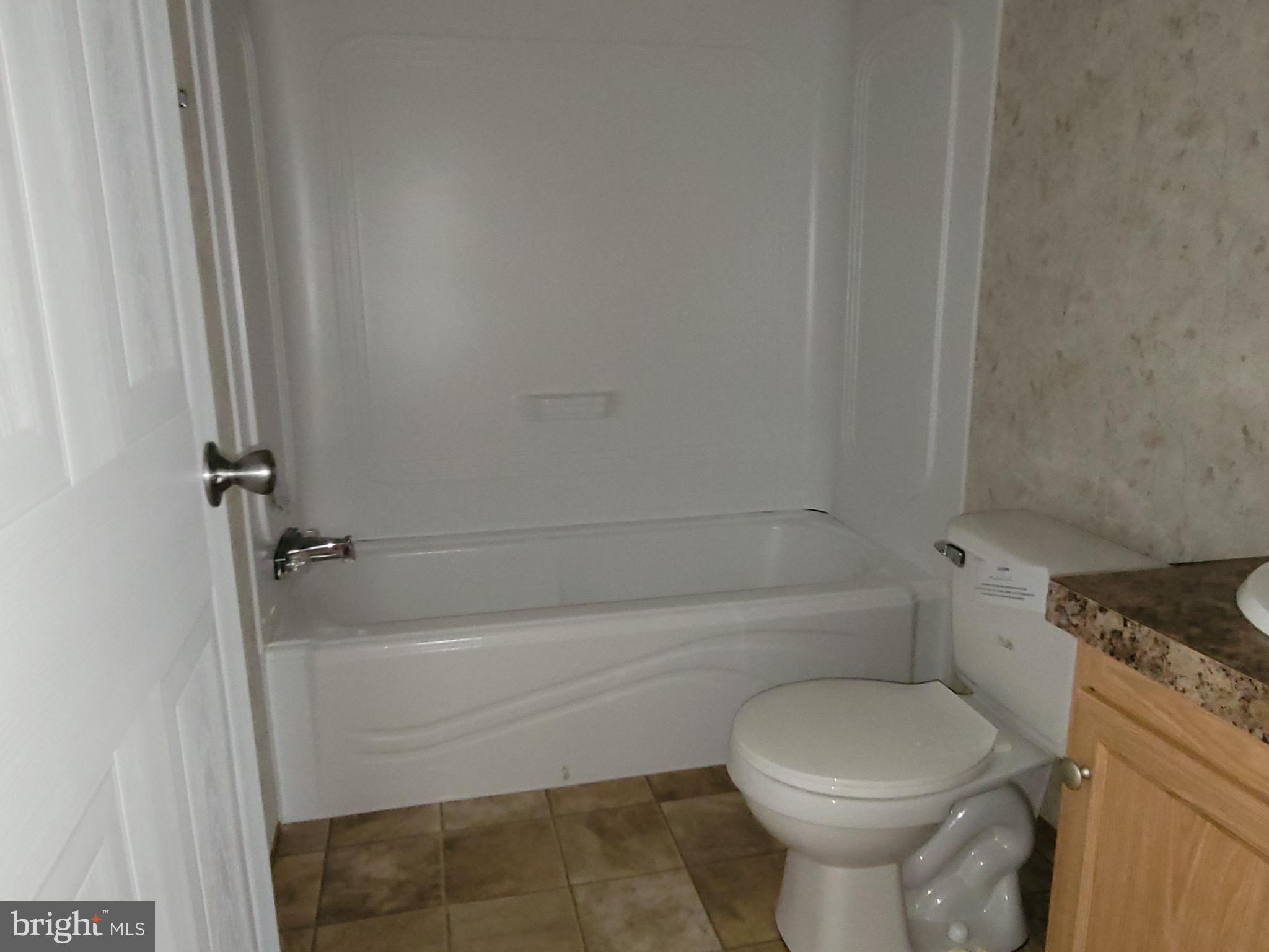 193 Shawnee Avenue Dover, PA 17315 - Photo 14 of 20 a bathroom with a toilet and a bathtub