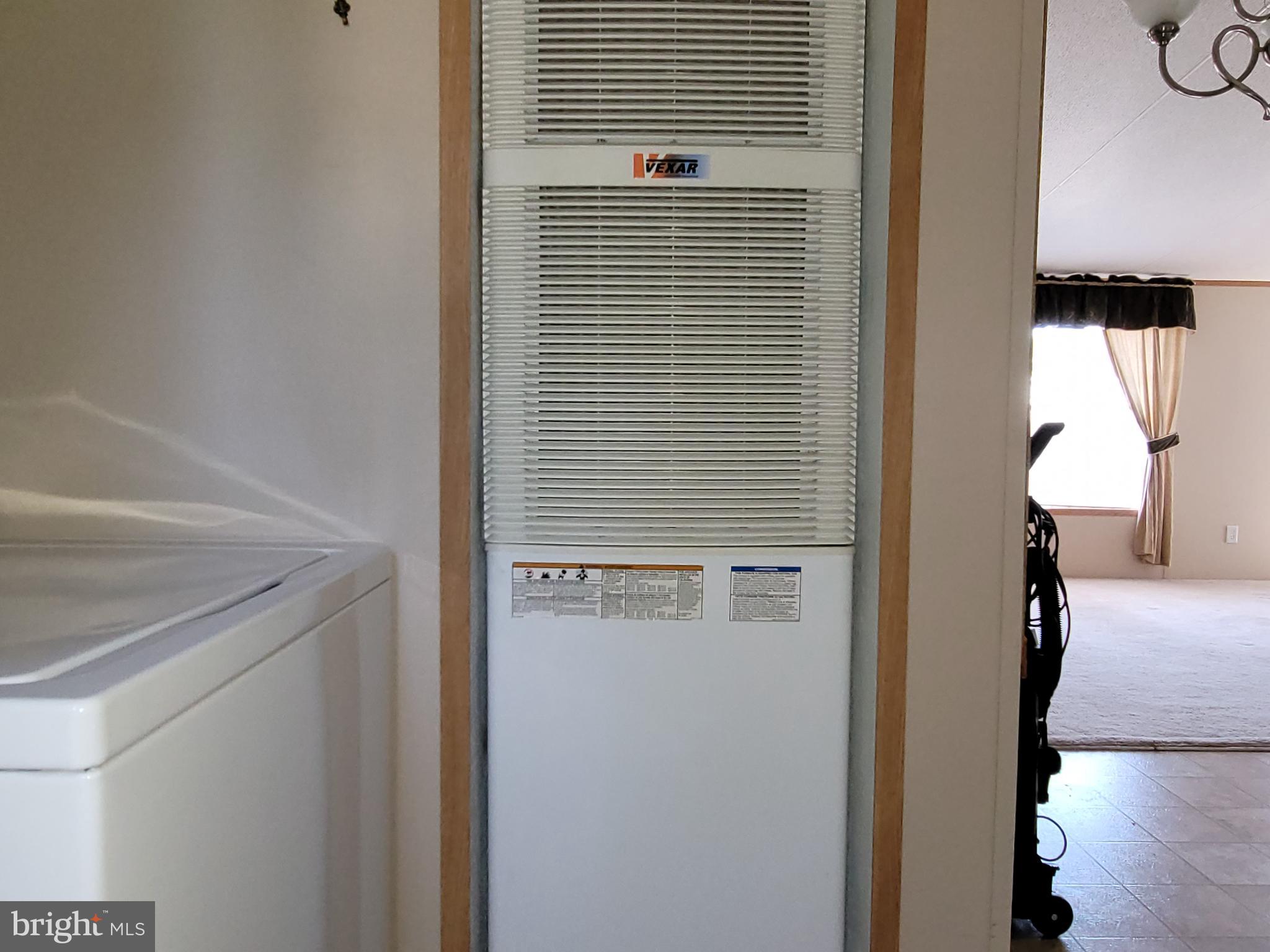 193 Shawnee Avenue Dover, PA 17315 - Photo 15 of 20 a view of a hallway and a car parked in garage