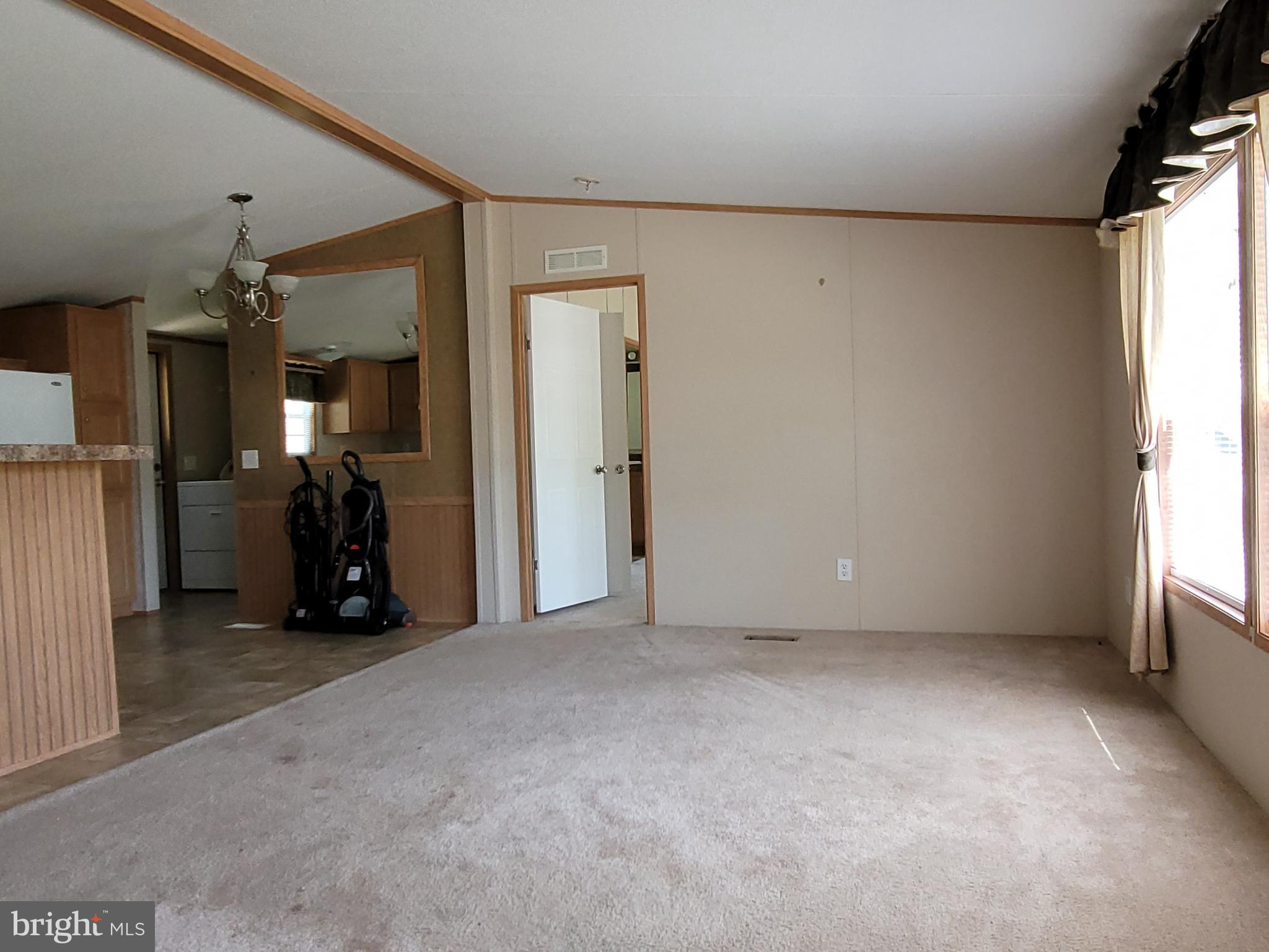 193 Shawnee Avenue Dover, PA 17315 - Photo 4 of 20 a view of empty room with stairs and a window
