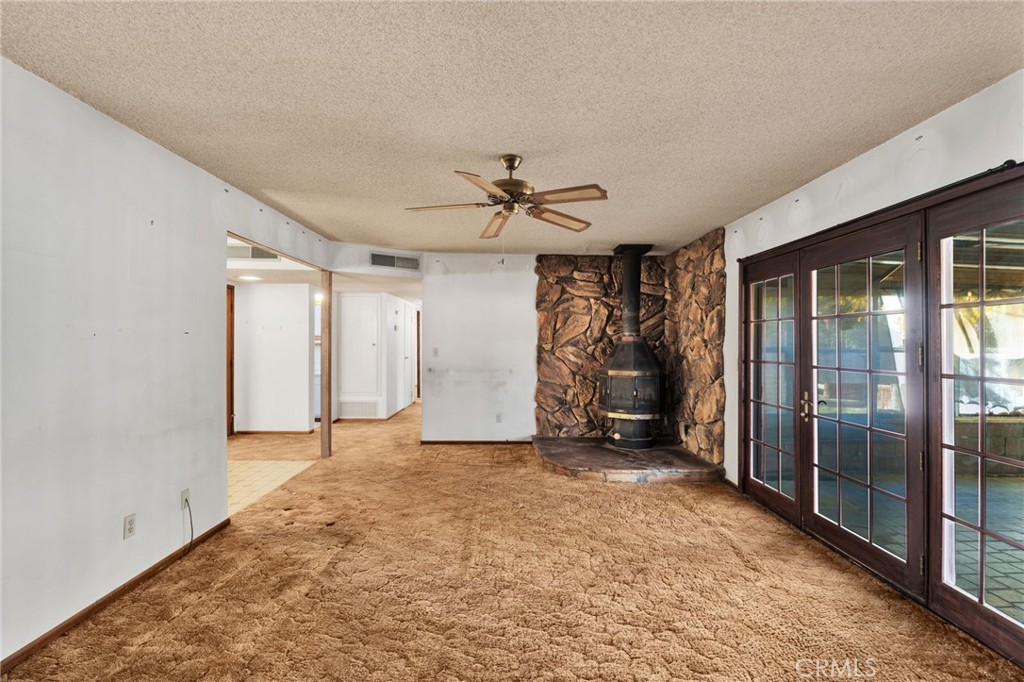 1405 Piute Street Barstow, CA 92311 - Photo 13 of 32 a view of a livingroom with a ceiling fan and window