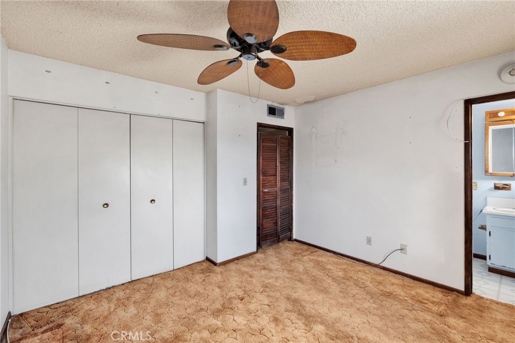 1405 Piute Street Barstow, CA 92311 - Photo 21 of 32 a view of a room with a ceiling fan