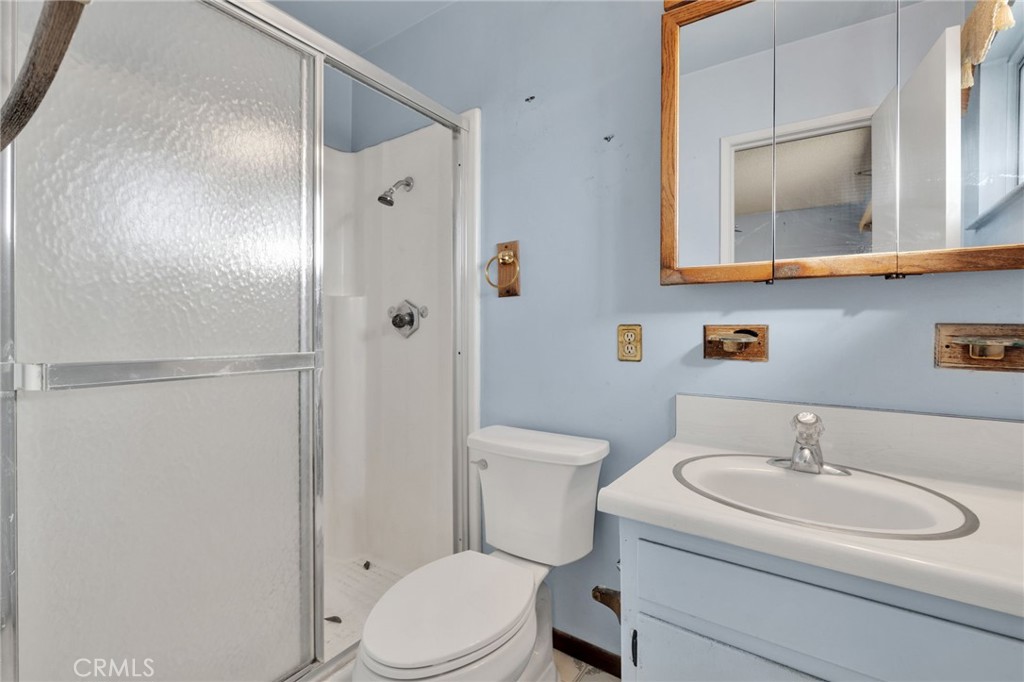 1405 Piute Street Barstow, CA 92311 - Photo 22 of 32 a bathroom with a sink toilet and shower