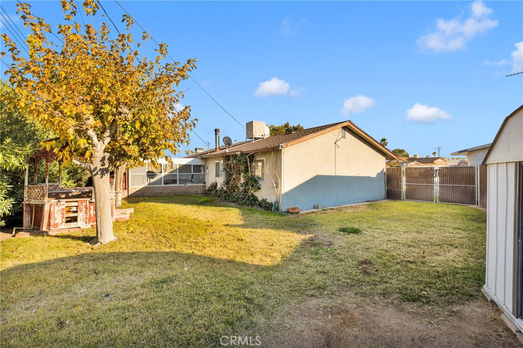 1405 Piute Street Barstow, CA 92311 - Photo 30 of 32 a view of a house with a yard