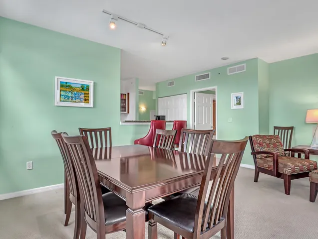 a view of a room with furniture and a flat screen tv