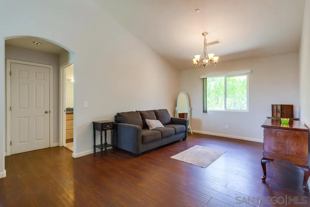 460 Pile Street Ramona, CA 92065 - Photo 12 of 25 a living room with furniture and a chandelier