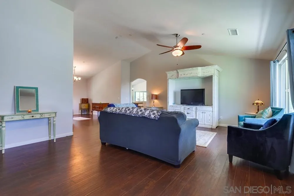 460 Pile Street Ramona, CA 92065 - Photo 2 of 25 a living room with furniture a flat screen tv and a chandelier