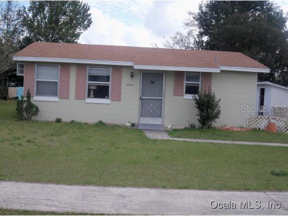 14369 Southwest 39th Ct Road Ocala, FL 34473 - Photo 1 of 1 a front view of a house with a garden