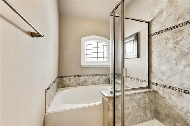 a bath tub sitting next to a window