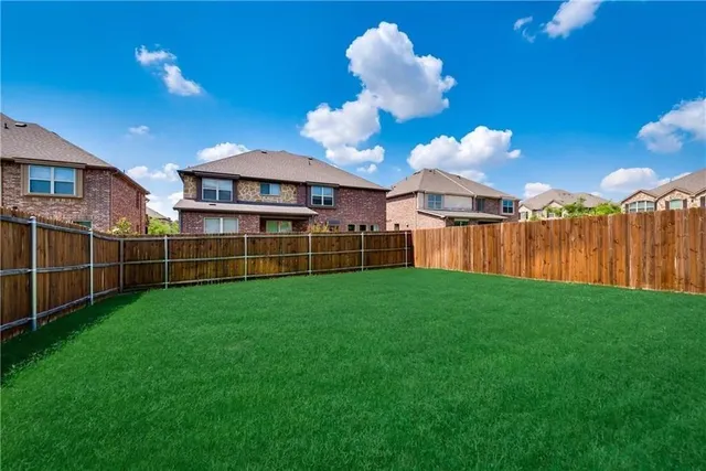 a view of a backyard with a garden