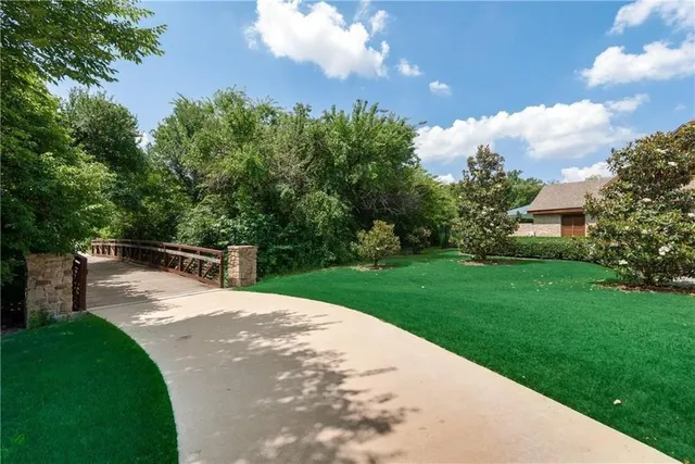 a view of a backyard with sitting area