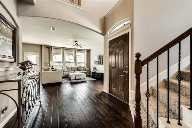 a view of a living room and a balcony