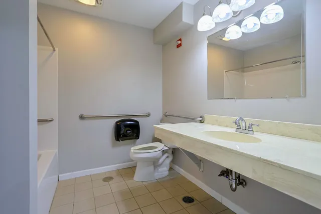 a view of hallway with wooden floor