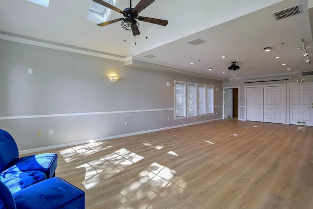 a view of an empty room with windows