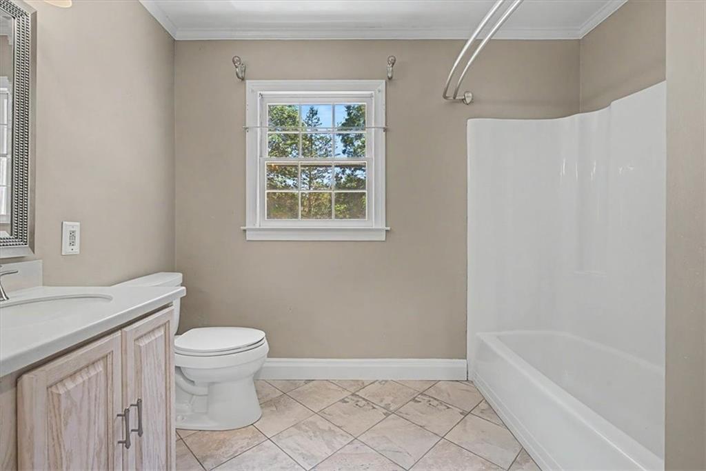 264 Bellemont Drive Southwest Rome, GA 30165 - Photo 18 of 37 a bathroom with a sink a toilet and shower