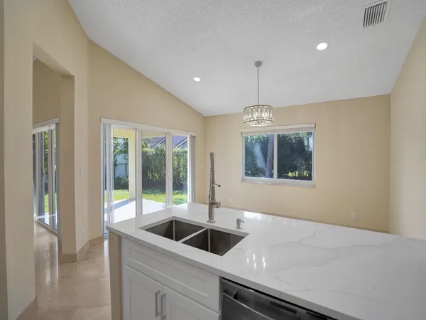 a view of a dining room with furniture window and outside view