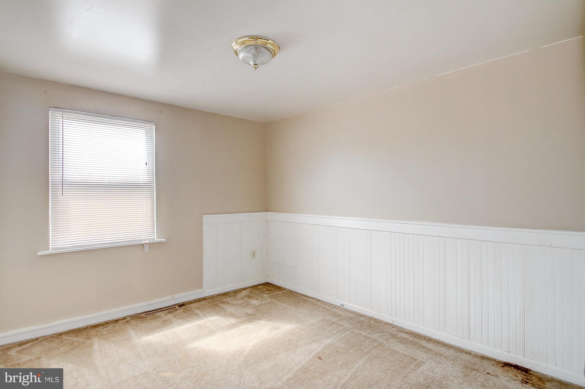 8036 Wynbrook Road Baltimore, MD 21224 - Photo 12 of 30 an empty room with a window