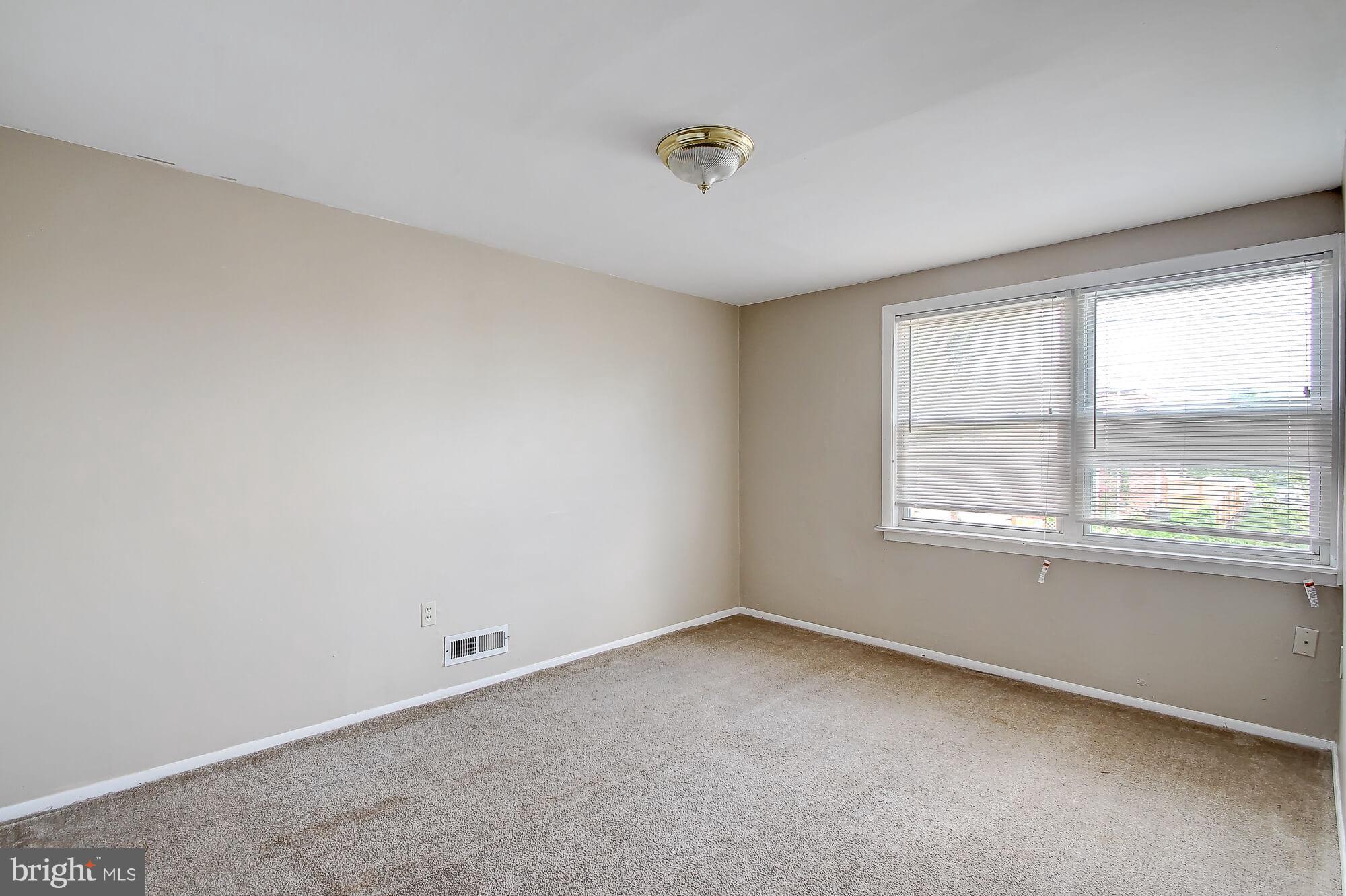 8036 Wynbrook Road Baltimore, MD 21224 - Photo 14 of 30 an empty room with a window