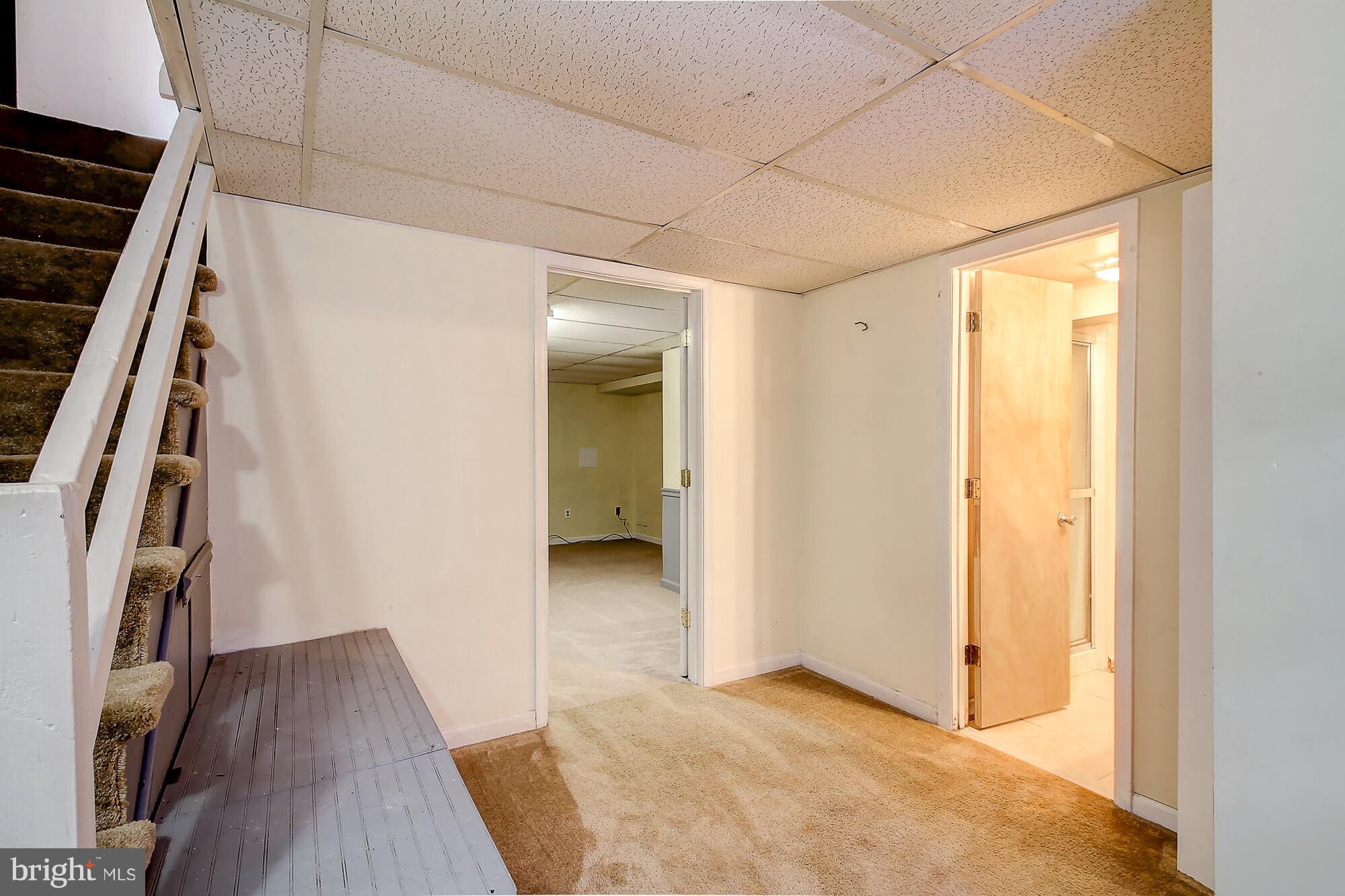8036 Wynbrook Road Baltimore, MD 21224 - Photo 19 of 30 a view of hallway with wooden floor