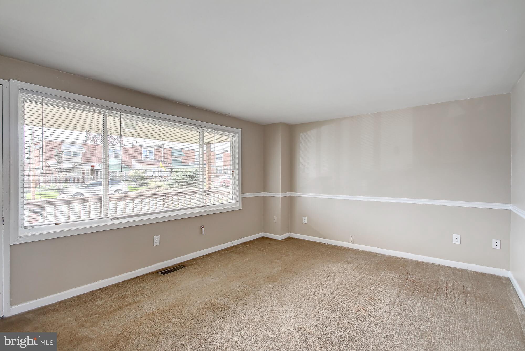 8036 Wynbrook Road Baltimore, MD 21224 - Photo 7 of 30 a view of an empty room with a window