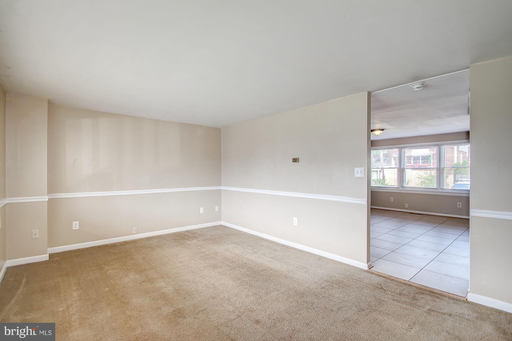 8036 Wynbrook Road Baltimore, MD 21224 - Photo 8 of 30 a view of an empty room with a window