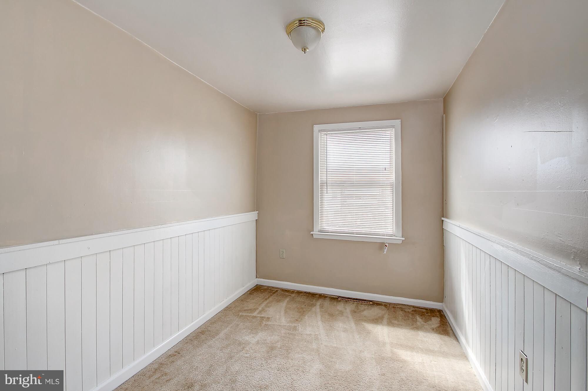 8036 Wynbrook Road Baltimore, MD 21224 - Photo 10 of 30 a view of an empty room with a window