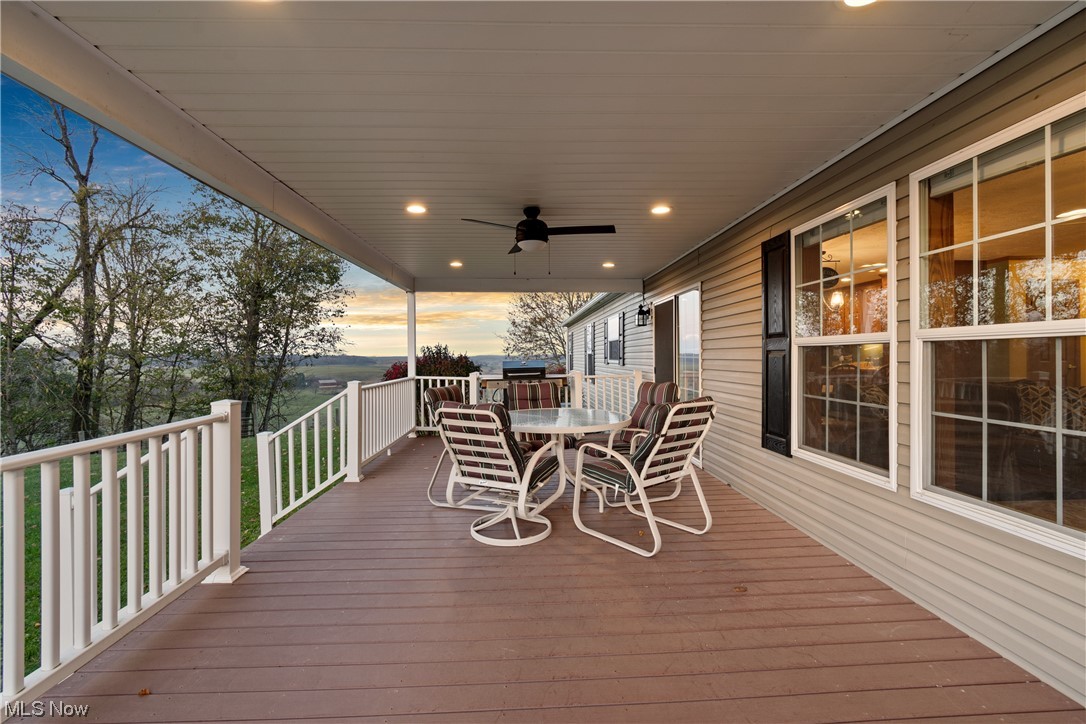 2240 Prysi Road Northwest Dover, OH 44622 - Photo 31 of 35 Deck at dusk with ceiling fan