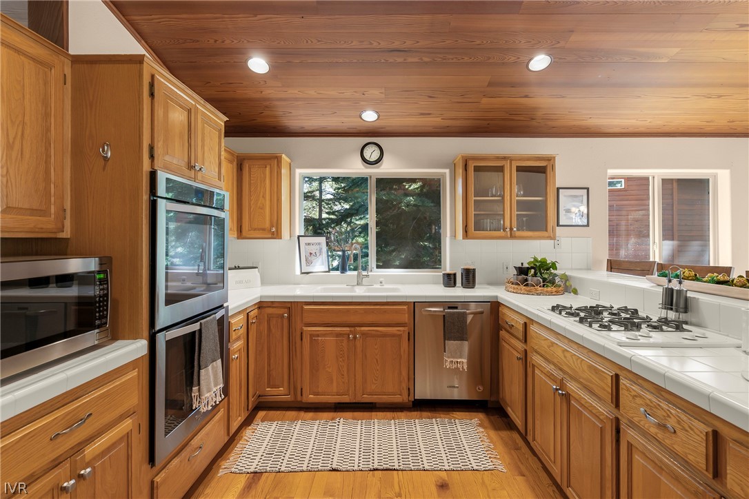 858 Jennifer Street Incline Village, NV 89451 - Photo 13 of 44 a kitchen with stainless steel appliances granite countertop a sink and stove