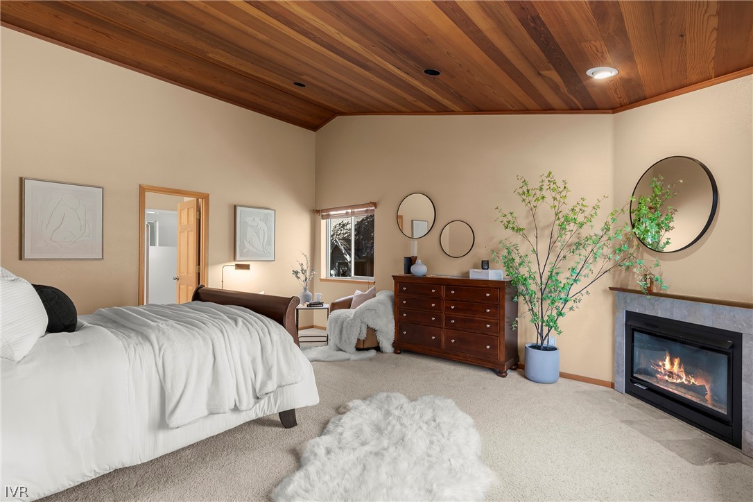 858 Jennifer Street Incline Village, NV 89451 - Photo 19 of 44 a bedroom with a bed and a fireplace