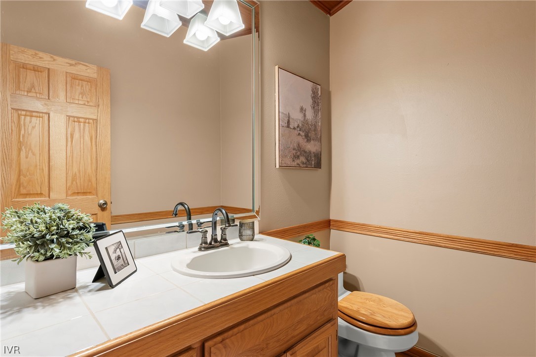 858 Jennifer Street Incline Village, NV 89451 - Photo 28 of 44 a bathroom with a sink a toilet and mirror