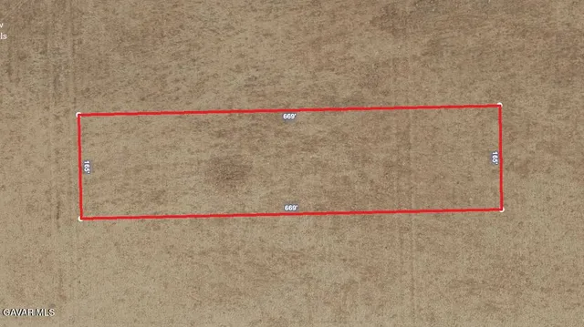 a white bath tub sitting next to a white wall