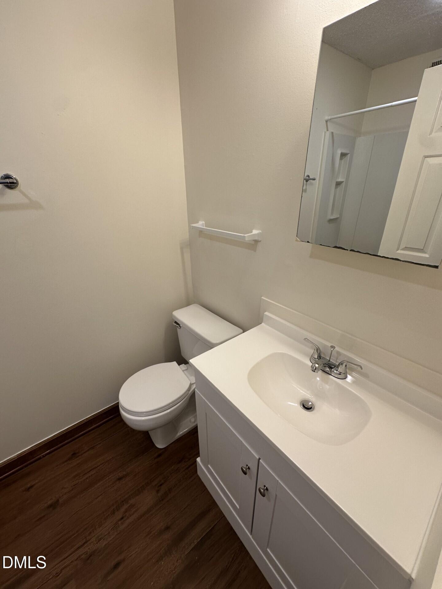 3520 Ivy Commons Drive, Unit 201 Raleigh, NC 27606 - Photo 6 of 7 a bathroom with a sink and a toilet