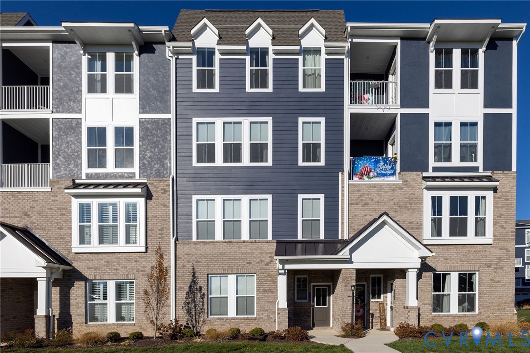 14435 Hancock Towns Drive Chesterfield, VA 23832 - Photo 1 of 34 a front view of a residential apartment building with a yard
