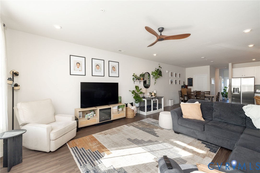14435 Hancock Towns Drive Chesterfield, VA 23832 - Photo 12 of 34 a living room with furniture and a flat screen tv