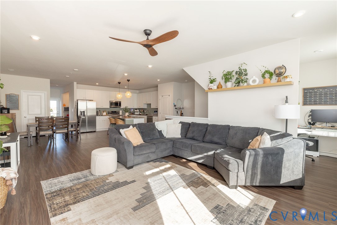 14435 Hancock Towns Drive Chesterfield, VA 23832 - Photo 13 of 34 a living room with furniture and a dining table with wooden floor