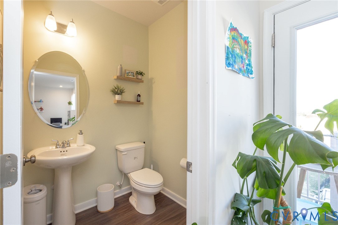 14435 Hancock Towns Drive Chesterfield, VA 23832 - Photo 14 of 34 a bathroom with a toilet sink and mirror