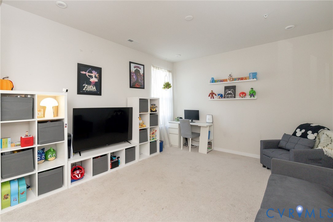 14435 Hancock Towns Drive Chesterfield, VA 23832 - Photo 16 of 34 a living room with furniture and a flat screen tv
