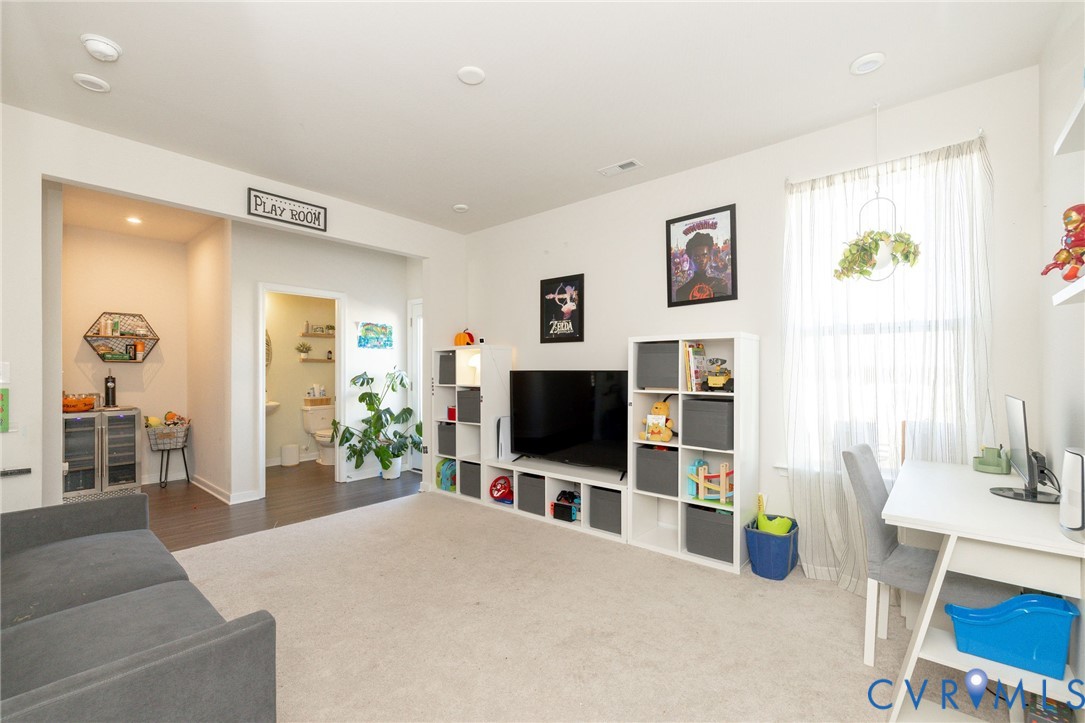 14435 Hancock Towns Drive Chesterfield, VA 23832 - Photo 17 of 34 a living room with furniture and a flat screen tv