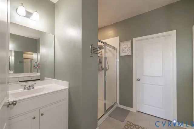 a bedroom with a bed table and a window