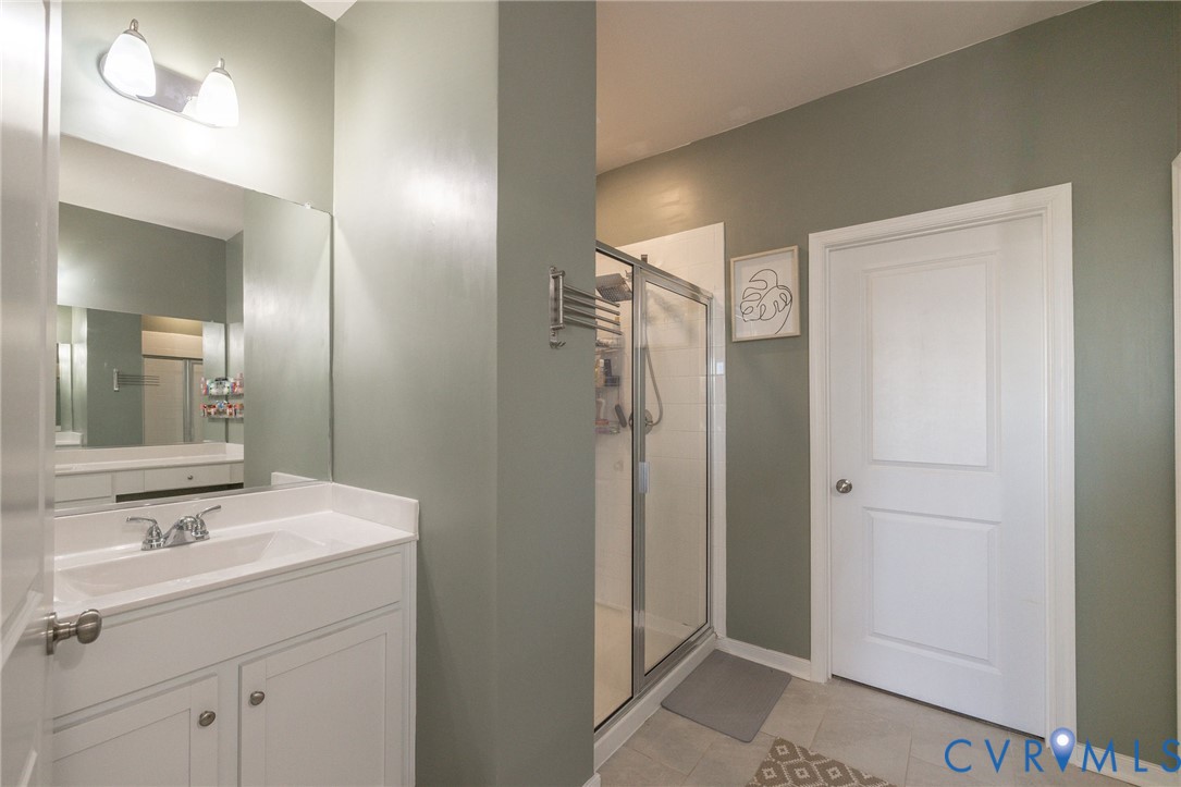14435 Hancock Towns Drive Chesterfield, VA 23832 - Photo 22 of 34 a bathroom with a sink and a mirror