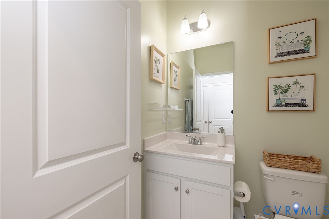 14435 Hancock Towns Drive Chesterfield, VA 23832 - Photo 28 of 34 a bathroom with a sink and a mirror