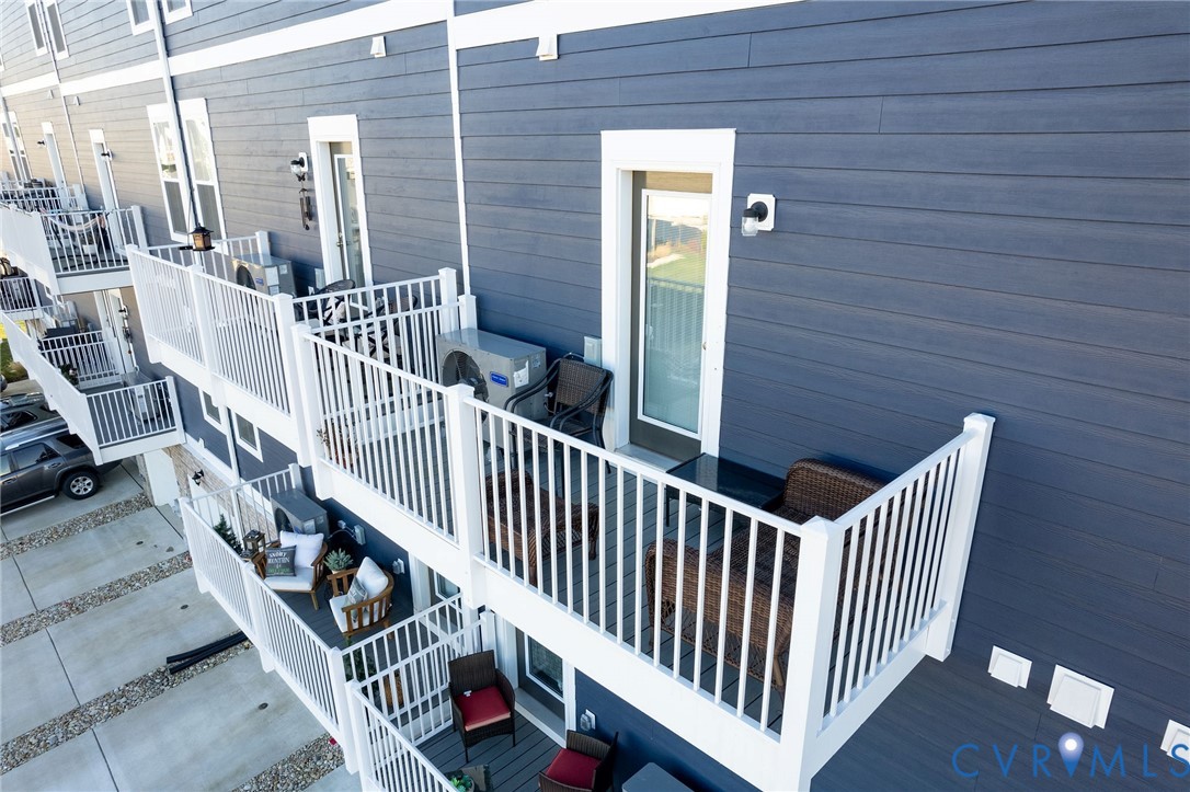14435 Hancock Towns Drive Chesterfield, VA 23832 - Photo 32 of 34 a view of staircase with railing and white walls