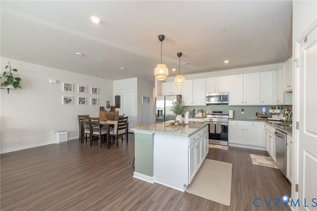 14435 Hancock Towns Drive Chesterfield, VA 23832 - Photo 4 of 34 a kitchen with white cabinets and counter space