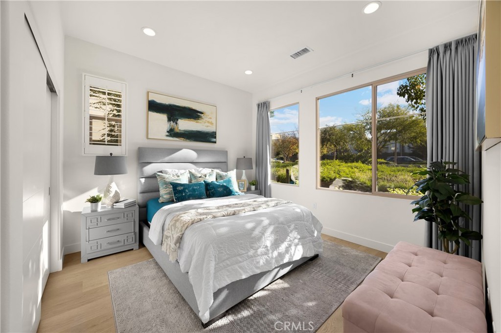 269 Magnet Irvine, CA 92618 - Photo 19 of 61 a bedroom with a bed and glass window