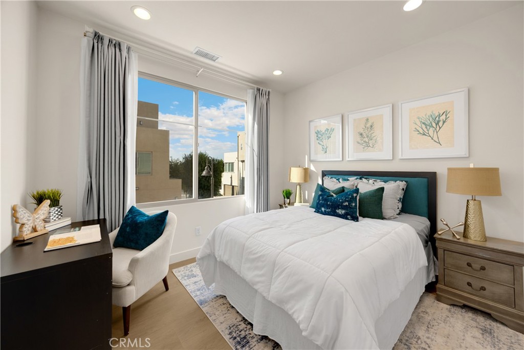 269 Magnet Irvine, CA 92618 - Photo 22 of 61 a bedroom with a bed and glass window