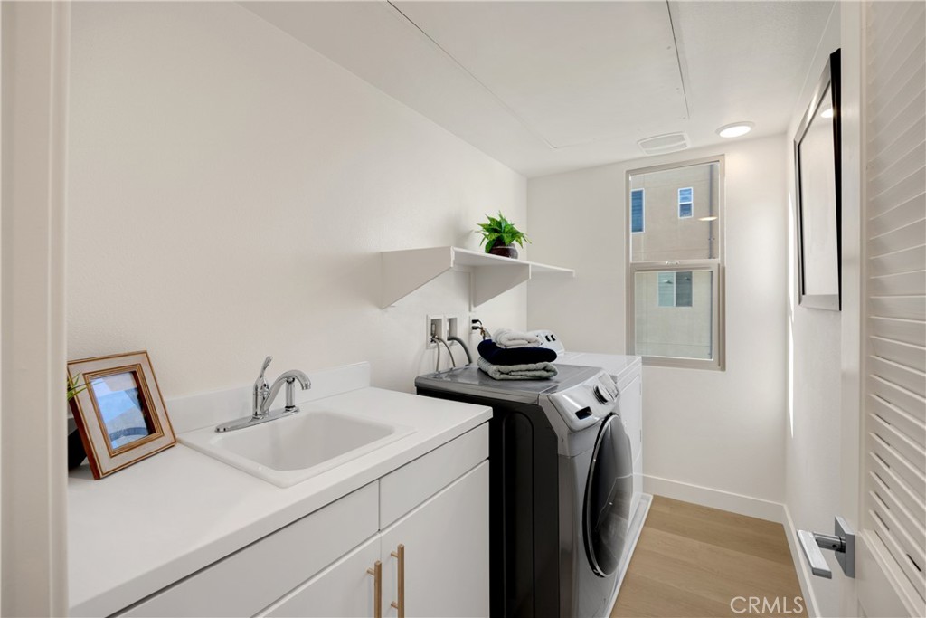 269 Magnet Irvine, CA 92618 - Photo 23 of 61 a view of a sink and washing machine in a room