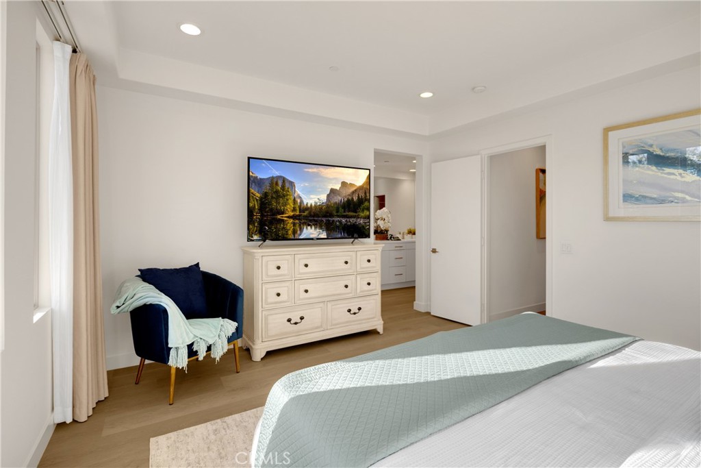 269 Magnet Irvine, CA 92618 - Photo 26 of 61 a bedroom with furniture and a flat screen tv