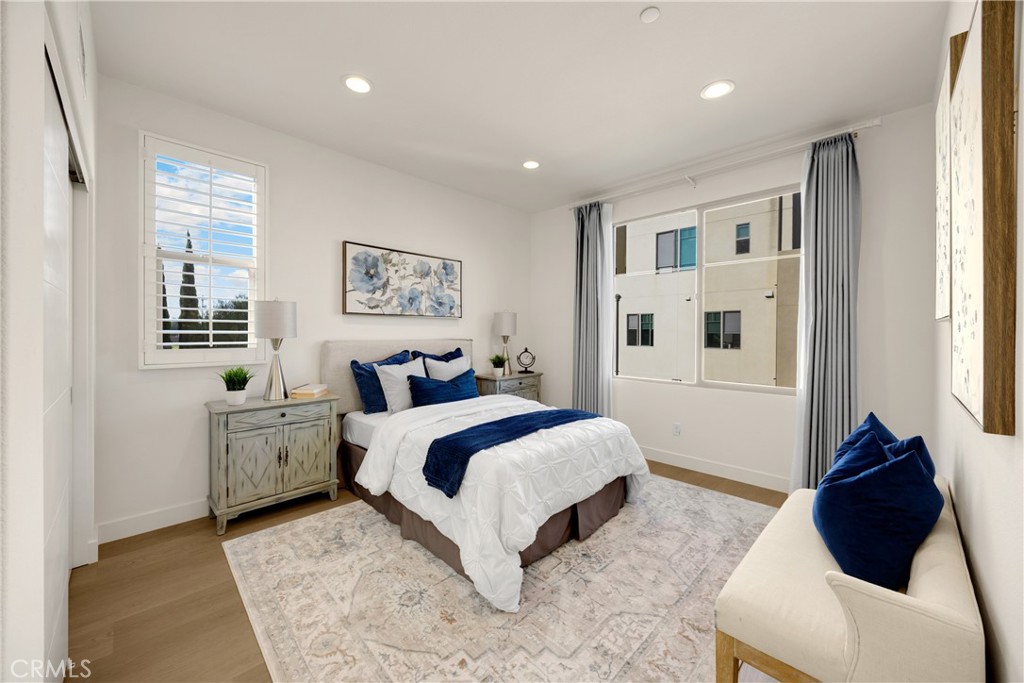 269 Magnet Irvine, CA 92618 - Photo 32 of 61 a spacious bedroom with a bed and a couch