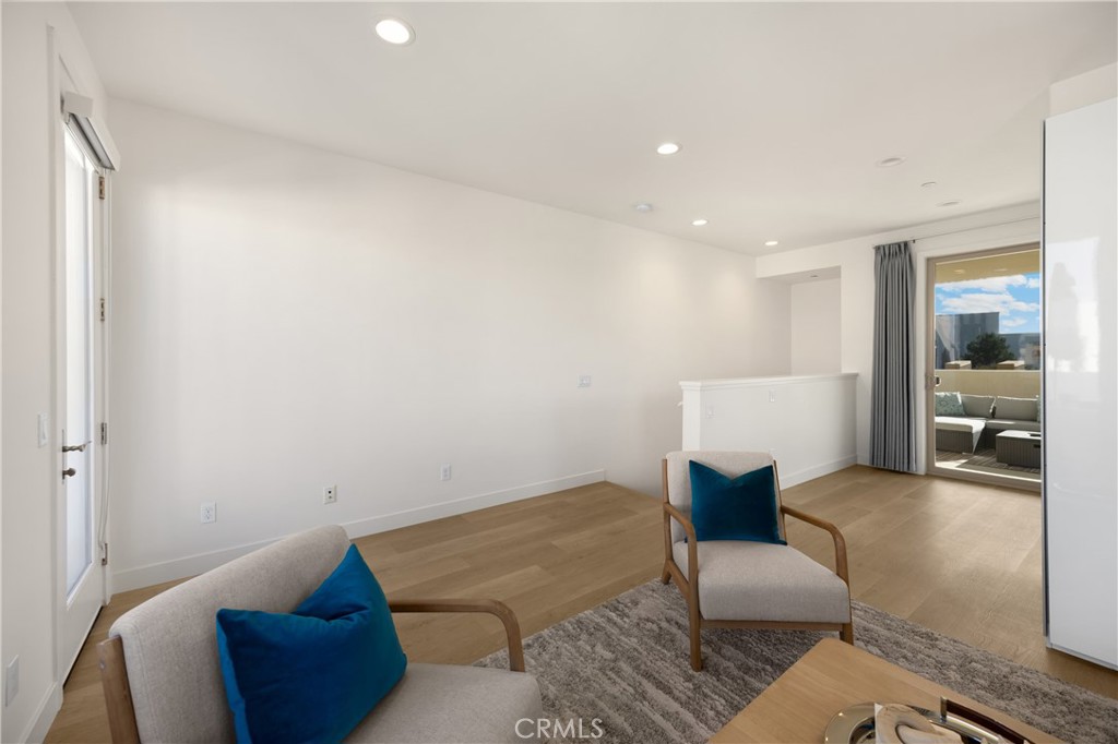 269 Magnet Irvine, CA 92618 - Photo 37 of 61 a living room with furniture and a wooden floor