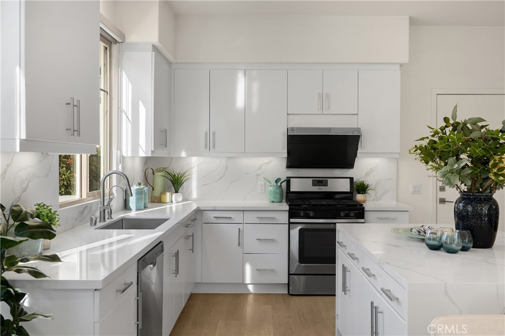 269 Magnet Irvine, CA 92618 - Photo 7 of 61 a kitchen with a sink stove and microwave